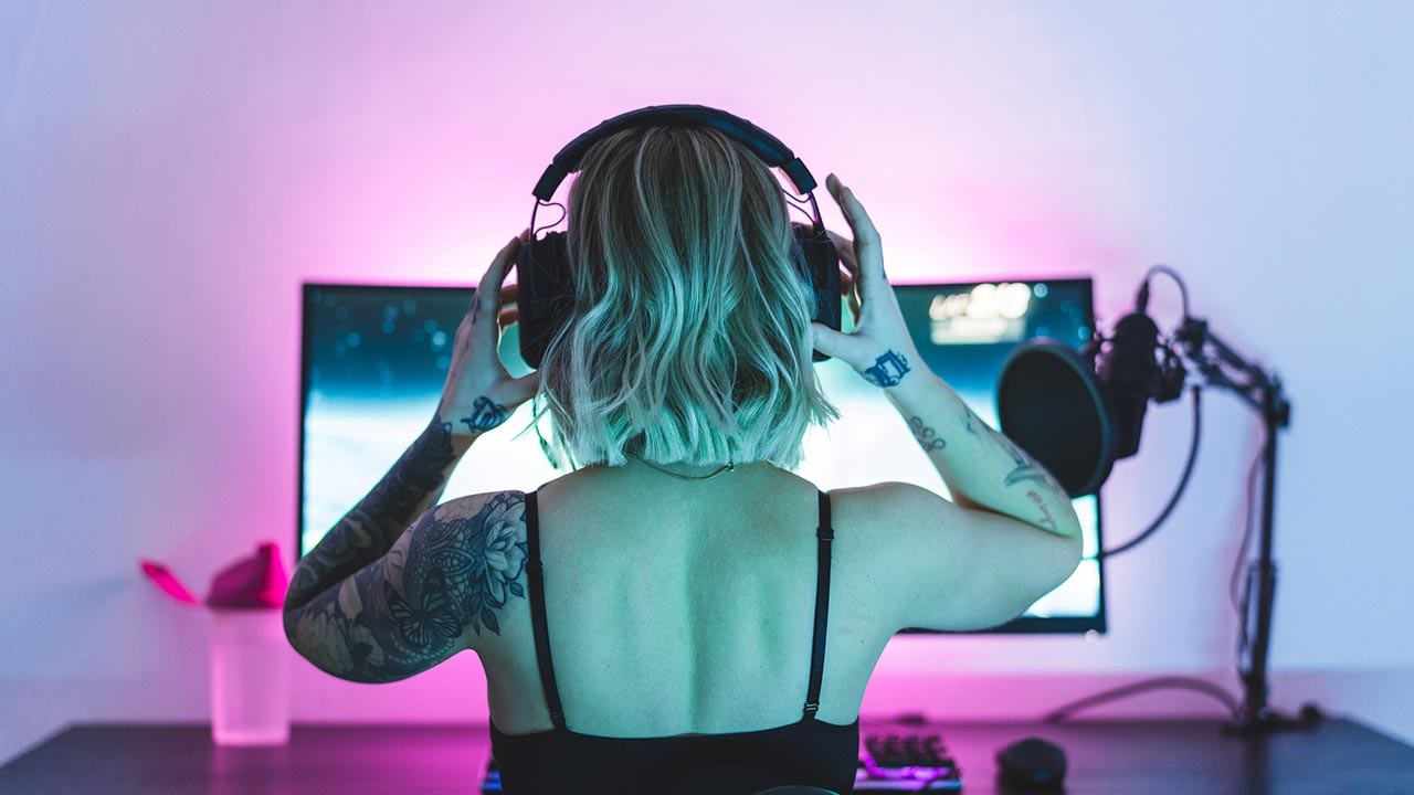 female gamer with headphones