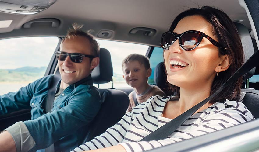 happy family rides in car