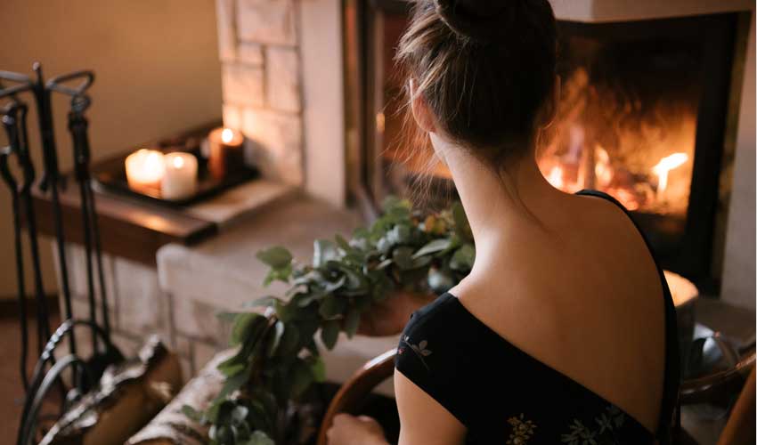 woman near fireplace